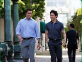 photo of two walking outside having a discussion