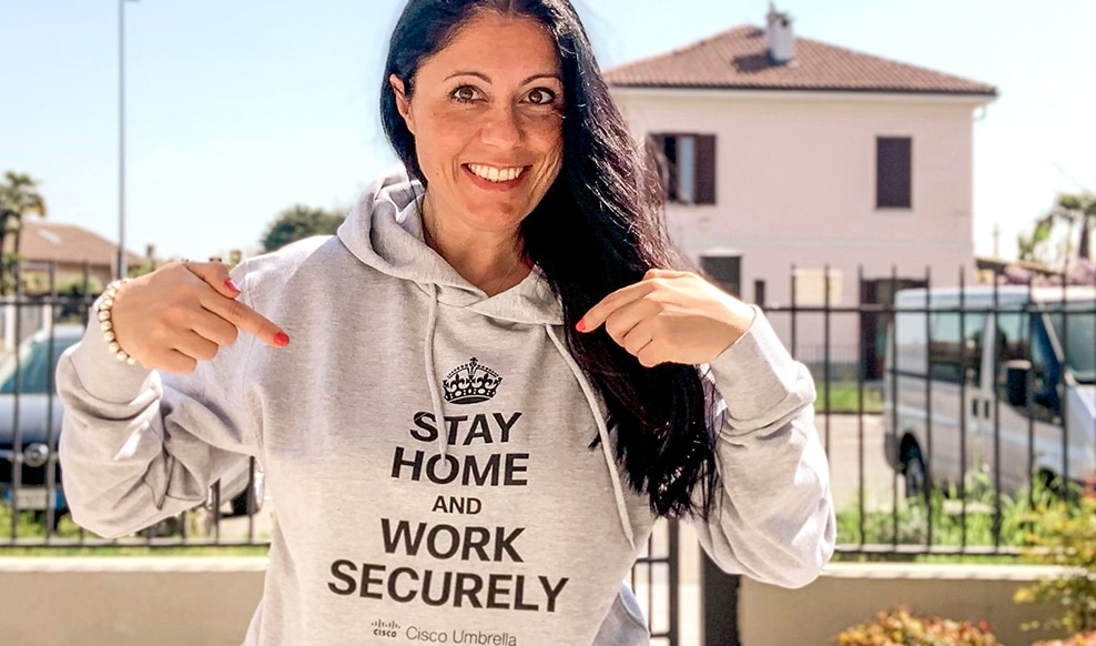 Person wearing a hoodie that reads, 'Stay home and work securely.'