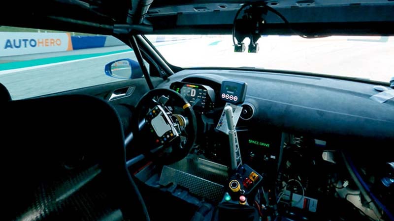 Interior view of the driver's seat in a race car with no driver