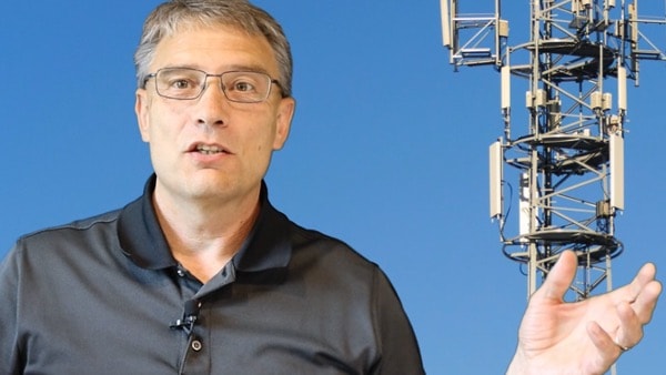 Person standing wireless tower with Choosing Wireless text