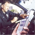 Policeman using technology