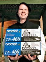 man holding a box of copy toner