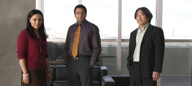 Asian man and woman at a conference table