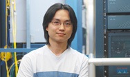 Picture of man smiling in a server room