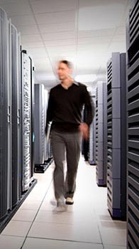 Man walking through server room