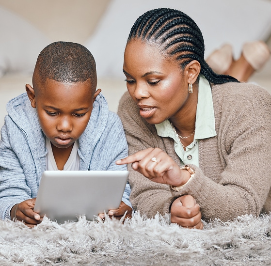 Mother and child using a tablet at home.