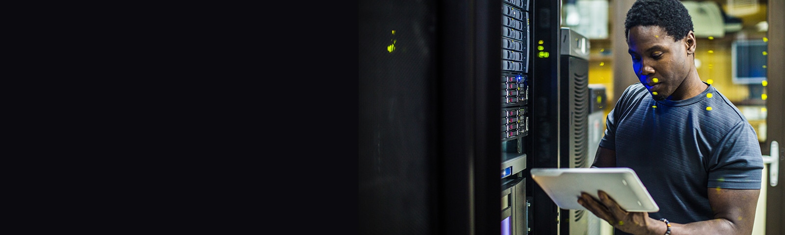 Person in data center holding a tablet