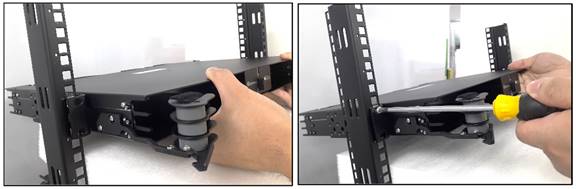 A hand holding a black objectDescription automatically generated