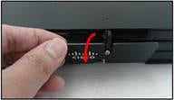 A hand pressing a button on a machineDescription automatically generated