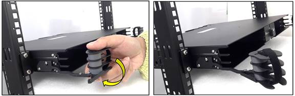 A hand holding a black objectDescription automatically generated