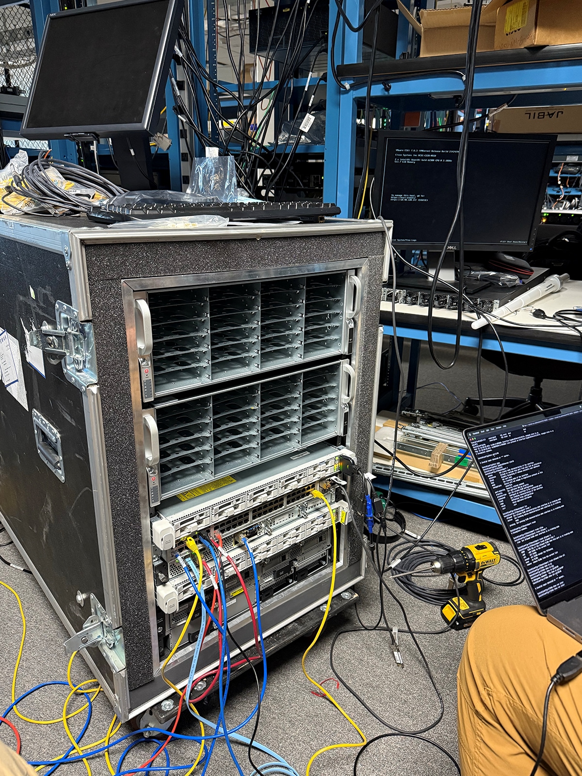 A large computer server with many wires and a monitorAI-generated content may be incorrect.