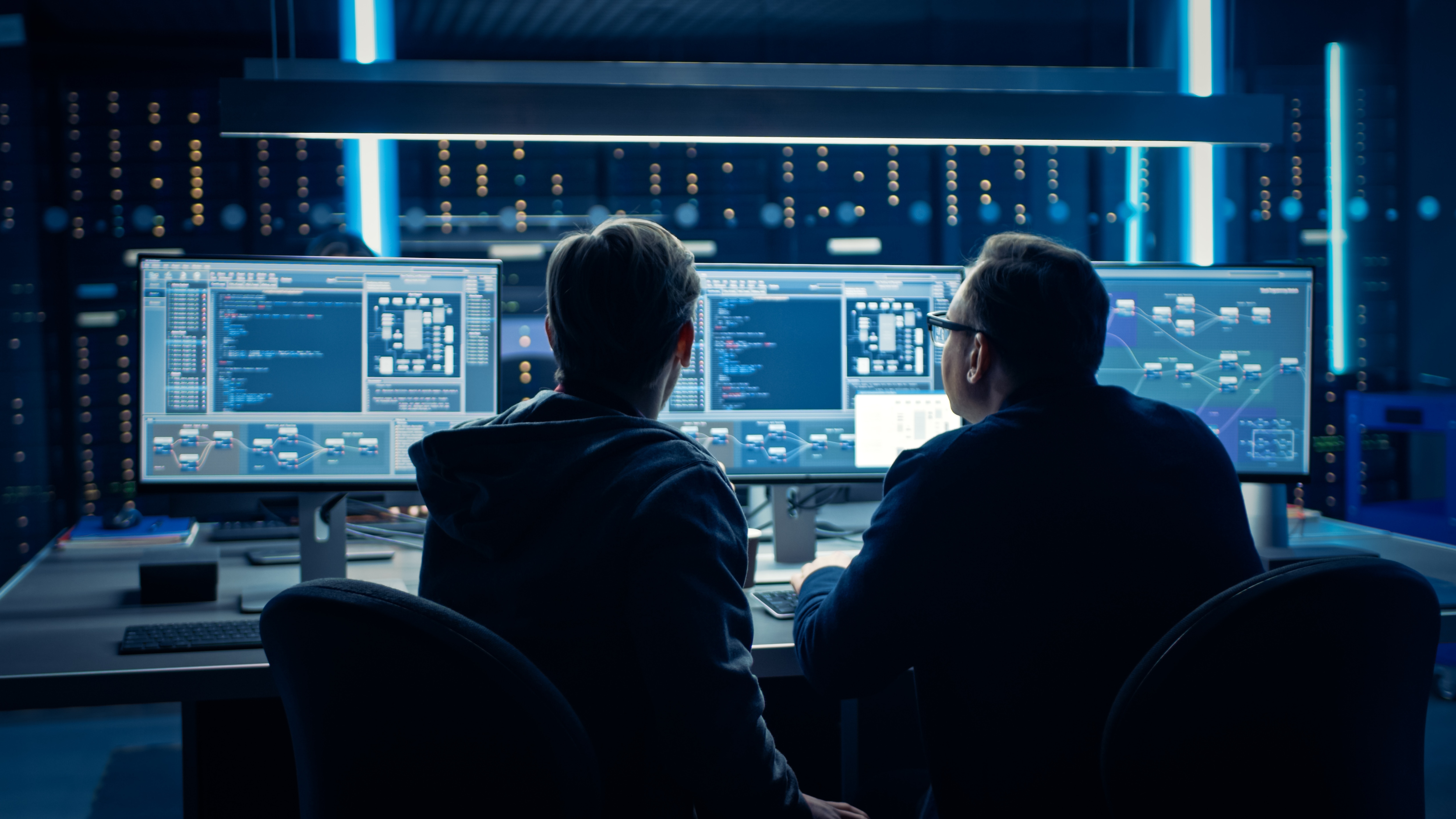 A group of people looking at a computer screenAI-generated content may be incorrect.