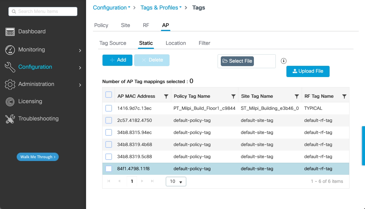 A table shows the policy tag name, site tag name, and RF tag name for each AP MAC address.