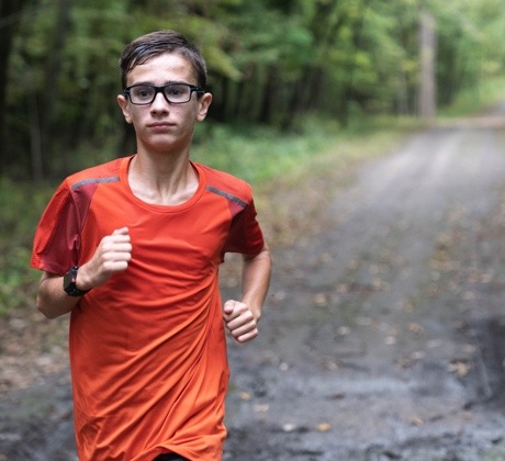 Donation recipient running through a forest