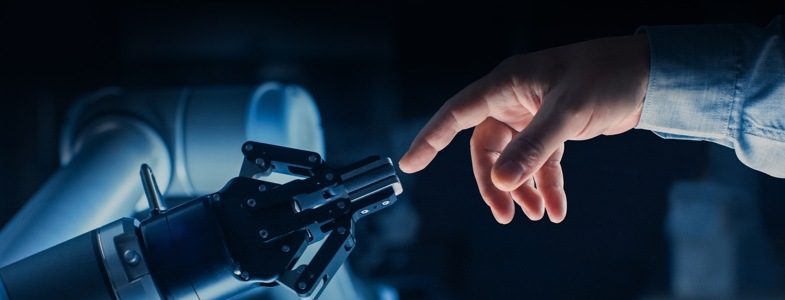 Human and robotic hand touching at fingers