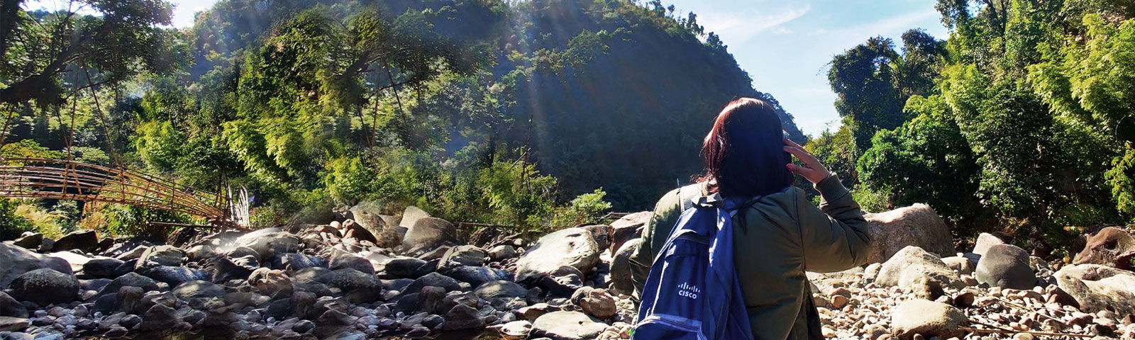 Female with Cisco backpack hiking in mountains in India