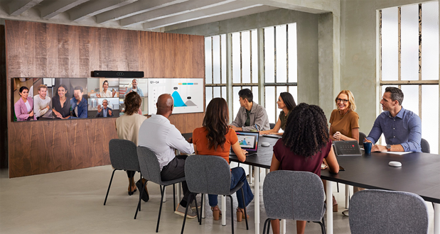 Cisco Room Bar Pro deployed with a triple-screen setup for video meeting and content sharing running the native Cisco RoomOS experience