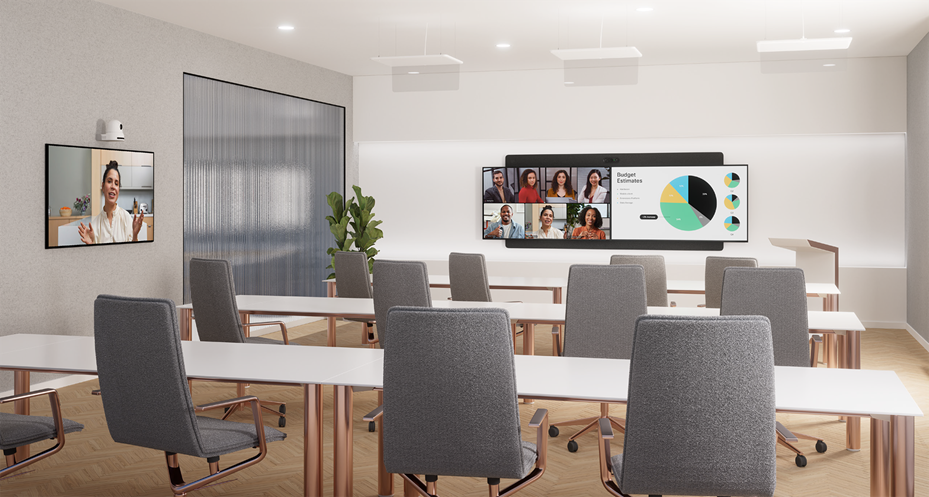 A room with a screen and tablesDescription automatically generated