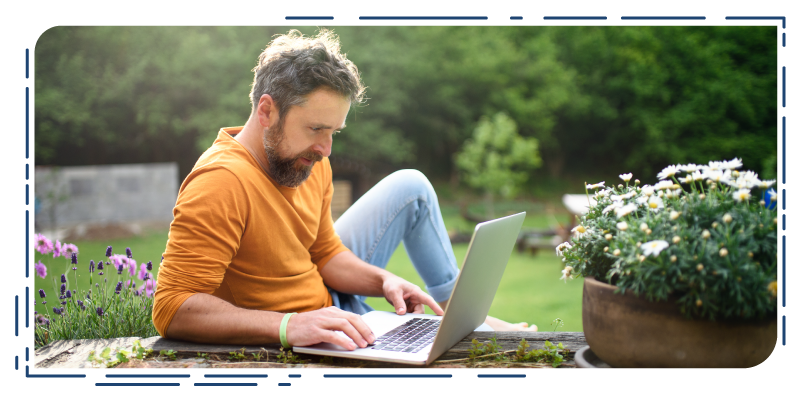 Man working outside on laptop 