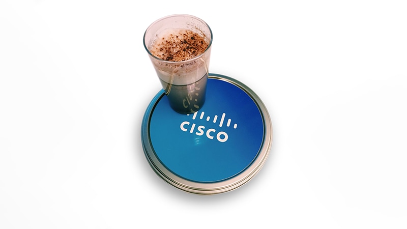Tall glass sits on a Cisco coaster.