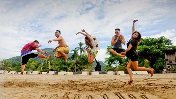 A group of people jumping up in the air.