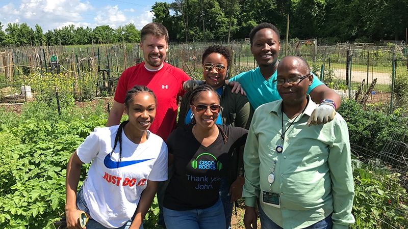 Six Cisco employees at an outdoor foodbank volunteer activity in Maryland, USA