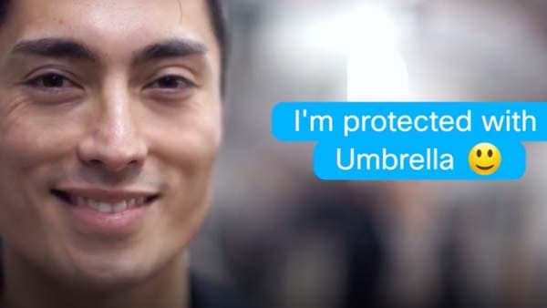 The phrase “I’m protected by Umbrella” is overlaid on a photo with a man’s face