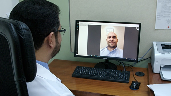 A virtual consultation between a doctor and his patient 