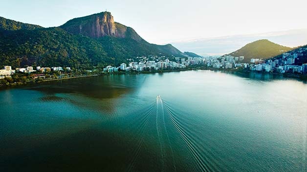 Coastal and mountainous region of Brazil with dwellings surrounded by water