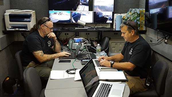 Two men coordinating disaster response