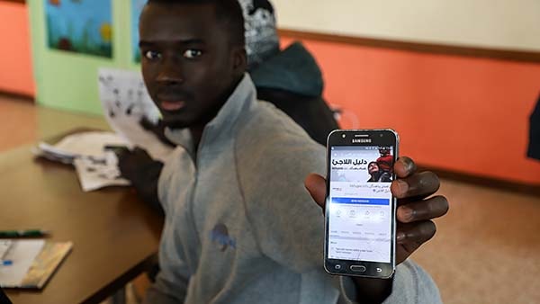 Refugee using mobile app
