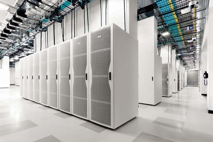 large room with multiple rows of servers