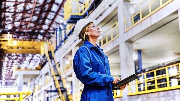 Factory worker inspecting operations