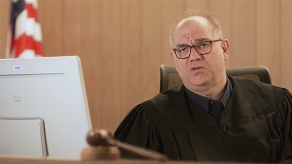 Judge in front of Webex unit