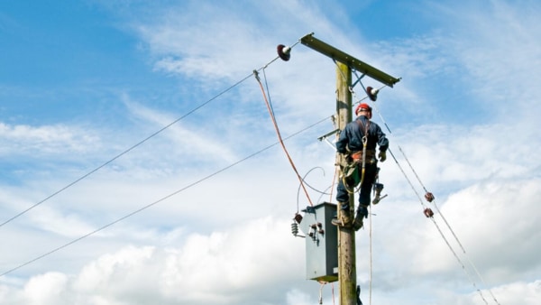 Man working at utility pole