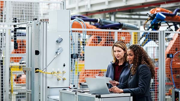 Two women on manufacturing floor