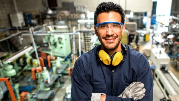 Manufacture worker smiling at camera
