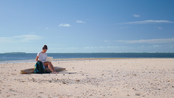 Student conducting her research on a remote beach 