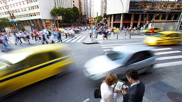 Blurred traffic Image with people collaborating over a tablet