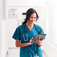 female doctor using iPad
