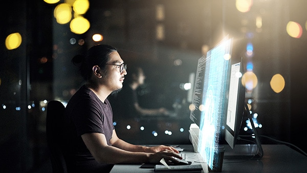 Man working on computer code