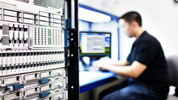 Blurry person sitting at a deck 