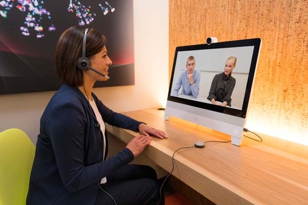 Woman using wired headset at DX80