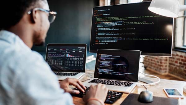 Data center engineer working on computer screen