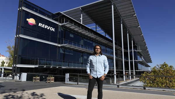 Santiago Maestro standing in front of Repsol building
