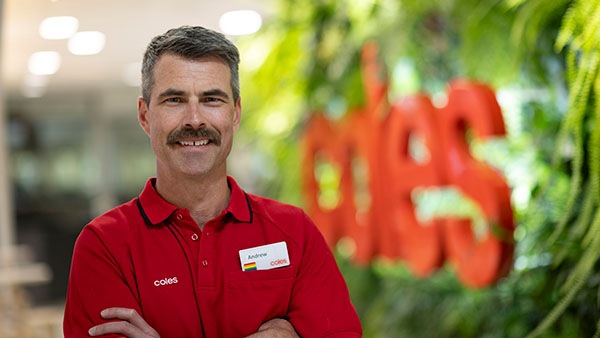 Man in grocery store smiling