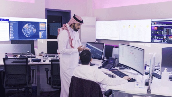 Two people working together at desk