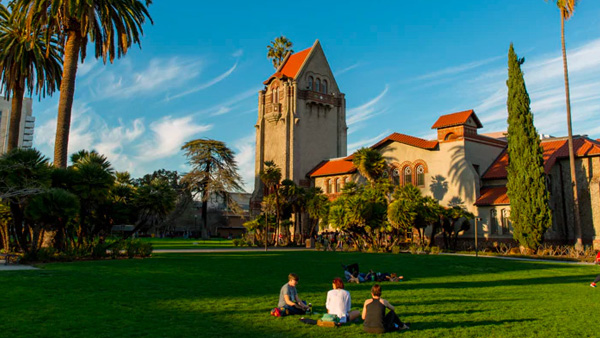 Students sitting on lawn at San Jose State University