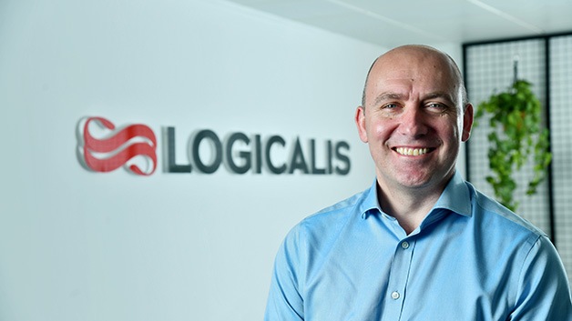 Bob Bailkoski smiling with Logicalis’ logo in the background 