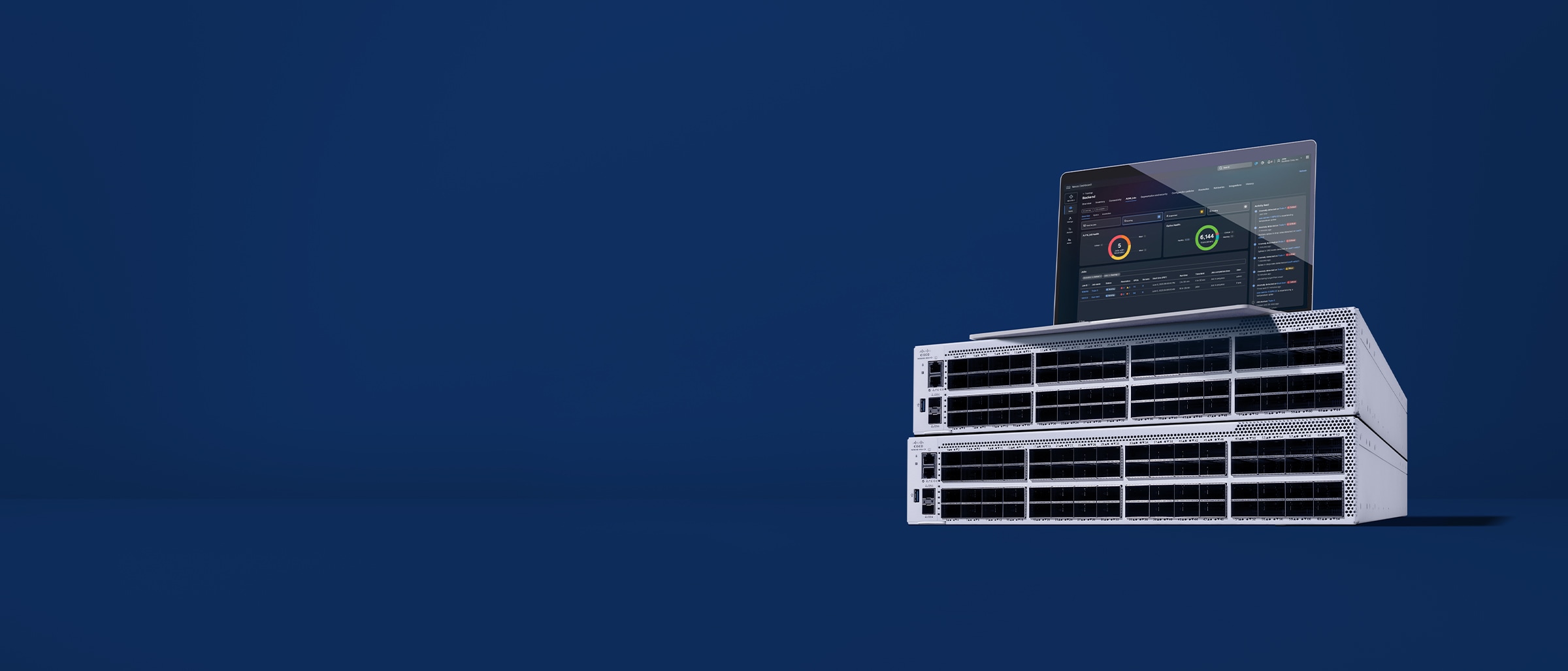 Cisco N9100 Series Switch with a laptop sitting above it displaying Nexus Dashboard